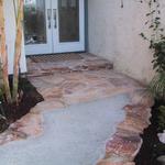 The old concrete is removed and replaced with a ribboned flagstone.  