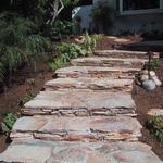 These flagstone stacked stairs are a wonderful addition to the entry area. In the evening, the path lighting enables easy access in the beautiful setting.