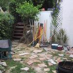 Moving around to the side patio area, we find an attempted flagstoen patio construction that went awry. 