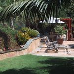 Moving arond to the rear patio/ outdoor living area the same flagstone incorporated in the side patio is again used here only now, for a high use area, the flagstone is laid on a concrete base and jointed with a mortar mix.